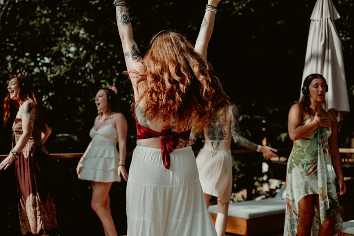 Guests dancing poolside at Taru