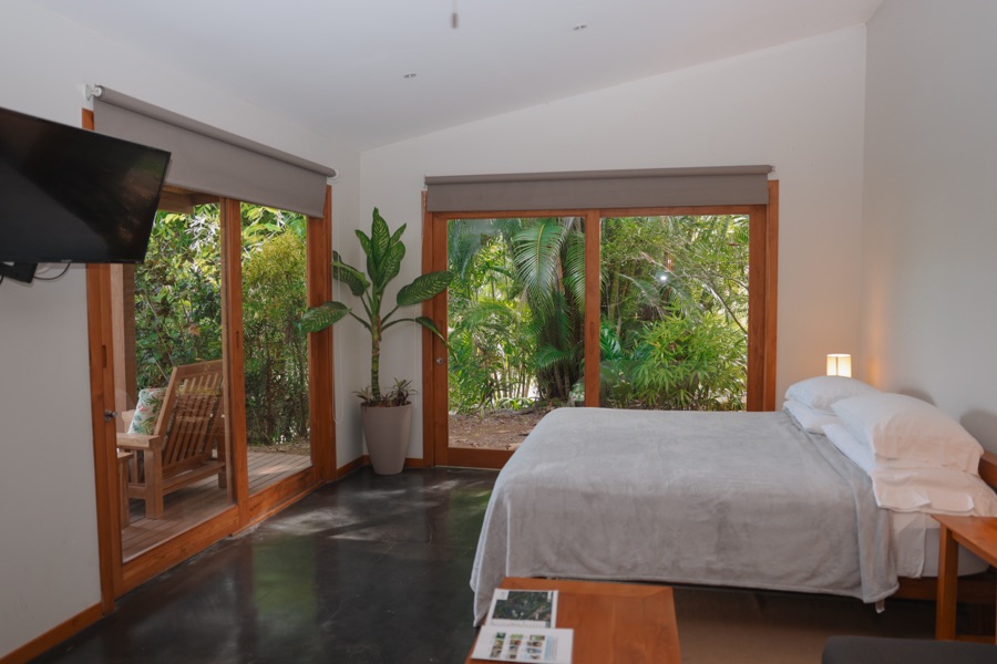 Garden Heights Studio vacation rental in Montezuma, Costa Rica: king bed and glass sliders opening to a private deck