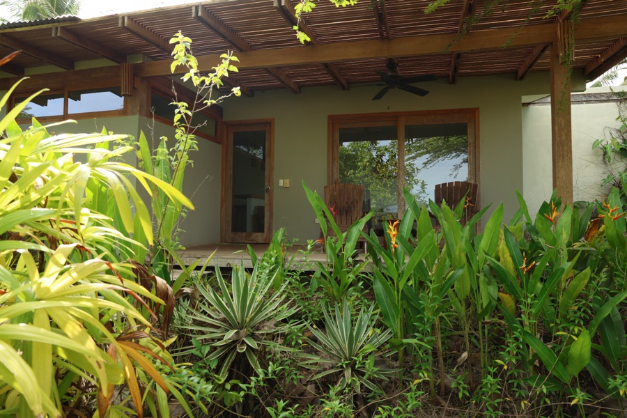 Private covered porch of the Oceanview Studio in Montezuma, Costa Rica, surrounded by tropical plants