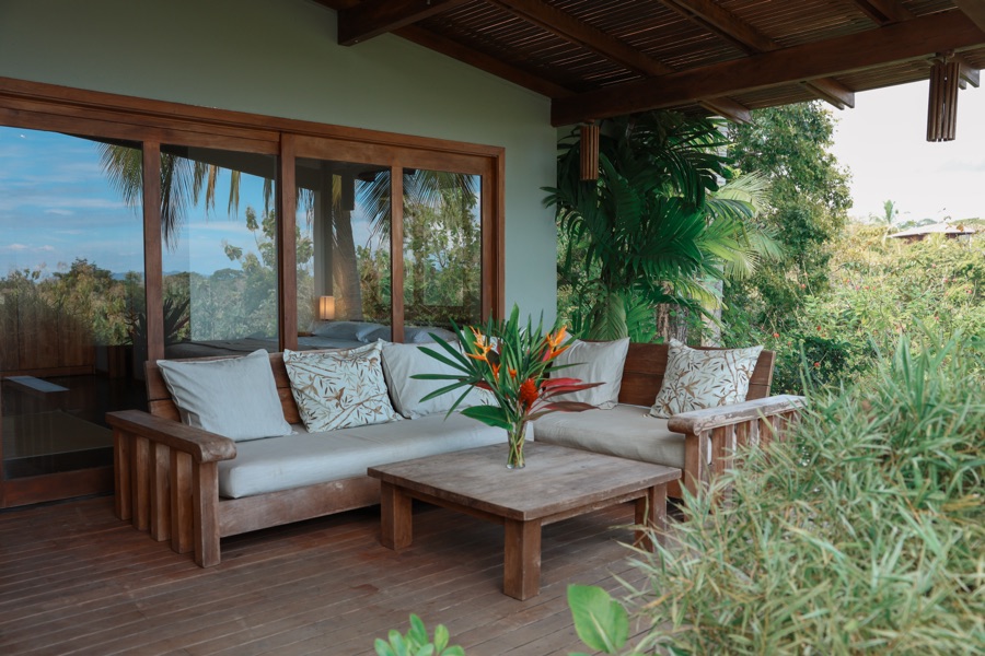 Sunrise Studio deck lounge with rainforest view